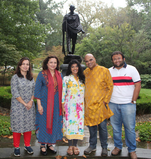 Posing with the statue of Gandhi