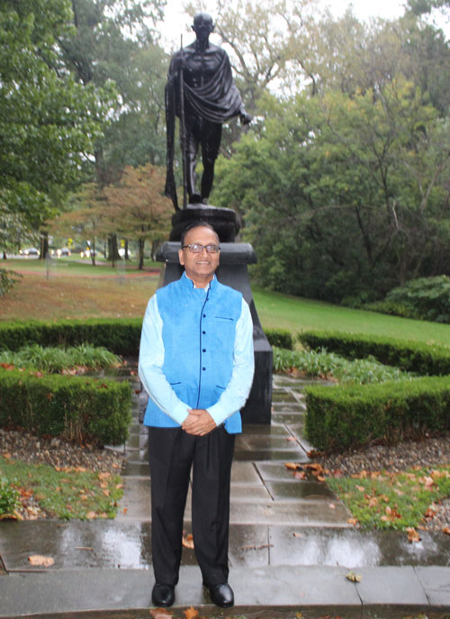 Posing with the statue of Gandhi