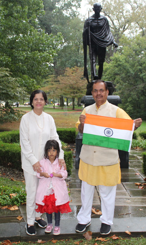 Posing with the statue of Gandhi