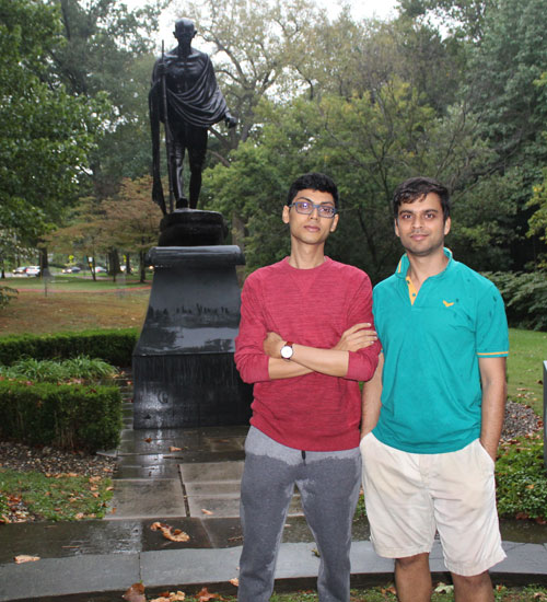 Posing with the statue of Gandhi