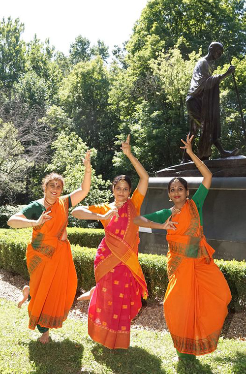 Students of Nartanam Academy of Dance at One World Day 2019 at India Cultural Garden in front of Mahtama Gandhi statue