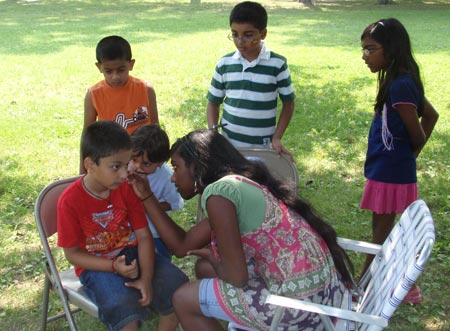 Young Indian Americans have their faces painted