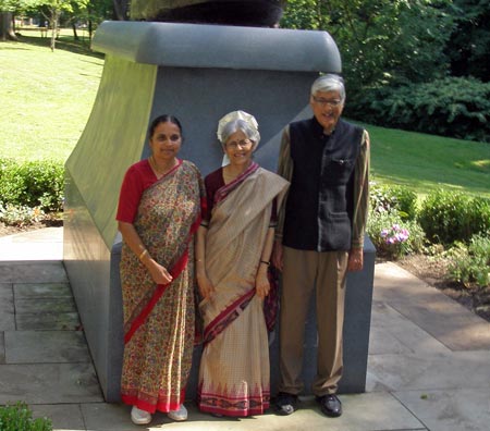 Rajmohan Gandhi and wife Usha pose in front of the Mahtama Gandhi statue in Cleveland Indian Cultural Gardens