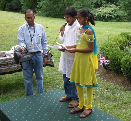 Children singing the opening prayer