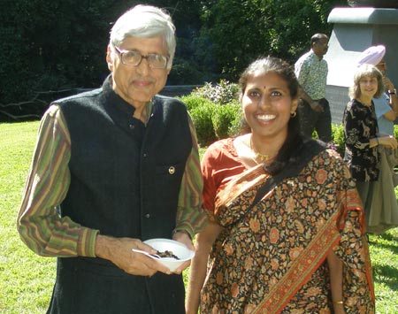 Rajmohan Gandhi and wife Usha pose in front of the Mahtama Gandhi statue in Cleveland Indian Cultural Gardens