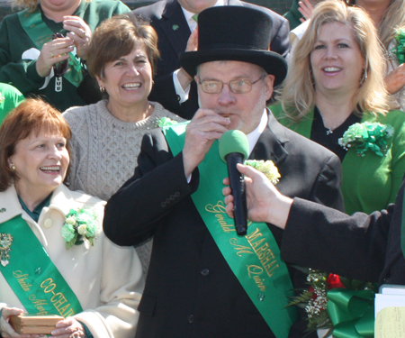 Grand Marshall Gerry Quinn blows the whistle to start the Parade