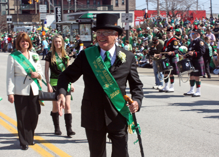 Grand Marshall Mickey McNally marching through the Cleveland Firefighters Memorial Pipes & Drums lines