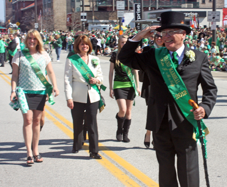 Grand Marshall Mickey McNally marching through the Cleveland Firefighters Memorial Pipes & Drums lines