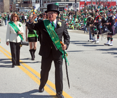 Grand Marshall Mickey McNally marching through the Cleveland Firefighters Memorial Pipes & Drums lines