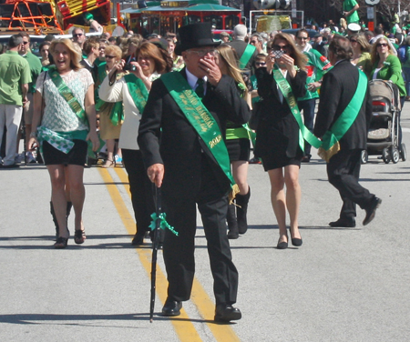 Grand Marshall Mickey McNally marching through the Cleveland Firefighters Memorial Pipes & Drums lines