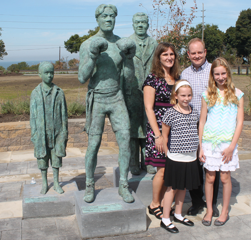 Kevin O'Toole family Posing at Johnny Kilbane statue in Battery Park in Cleveland Ohio