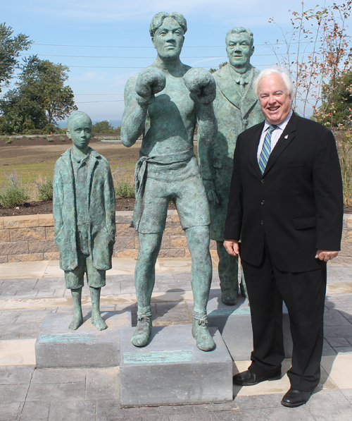 Tom Corrigan Posing at Johnny Kilbane statue in Battery Park in Cleveland Ohio