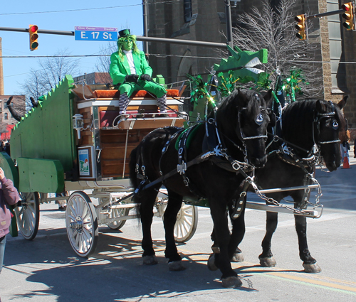 Green guy with horses