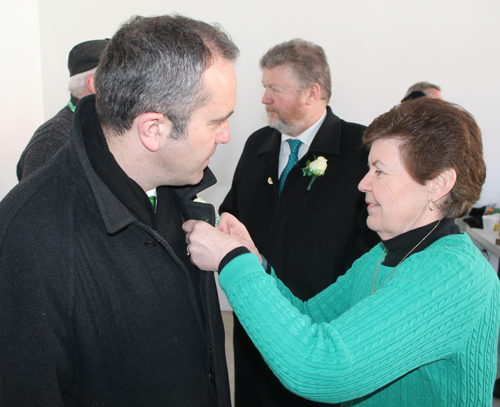 Consul General Aidan Cronin getting a flower