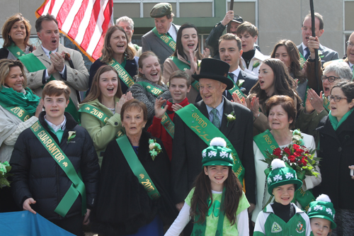 Dignitaries gathered on the steps of the Bishop Cosgrove Center before the Parade