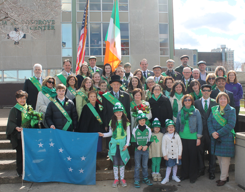 Dignitaries gathered on the steps of the Bishop Cosgrove Center before the Parade