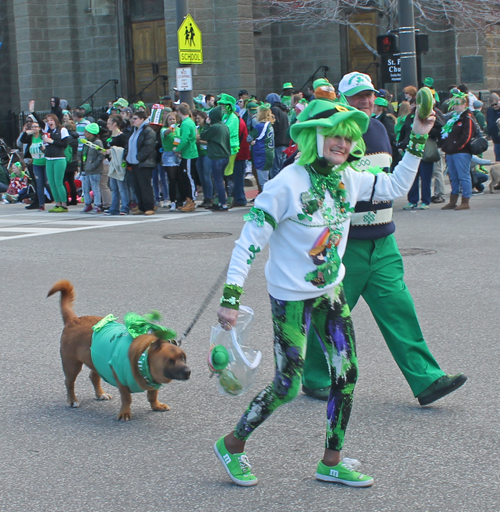 girl with dog at parade