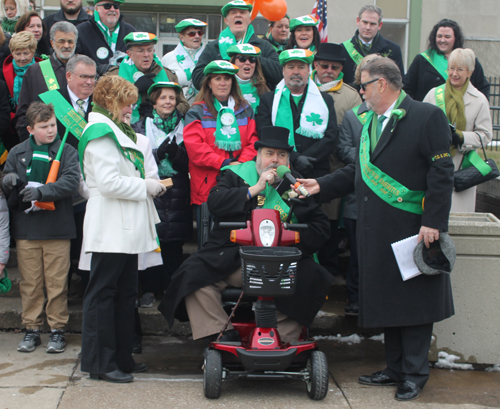 Grand Marshall Roger Weist blows the whistle to start the Parade