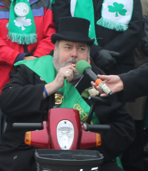 Grand Marshall Roger Weist blows the whistle to start the Parade