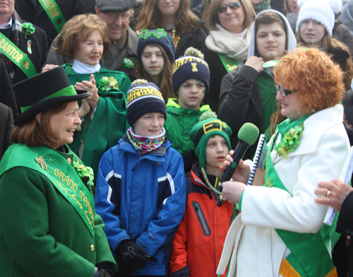 Shannon Corcoran gives whistle to Grand Marshall Sheila Murphy Crawford