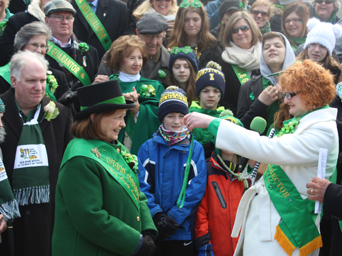 Shannon Corcoran gives whistle to Grand Marshall Sheila Murphy Crawford