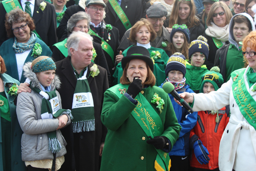 Grand Marshall Sheila Murphy Crawford blows the whistle to start the parade