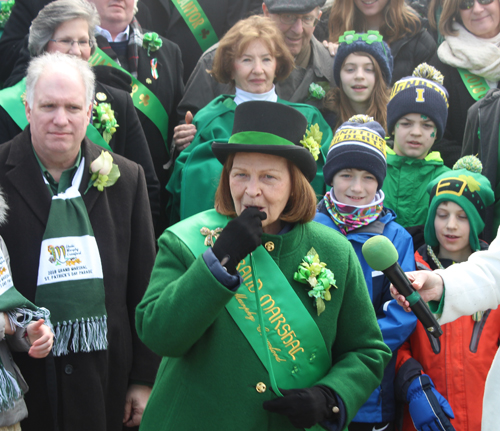 Grand Marshall Sheila Murphy Crawford blows the whistle to start the parade