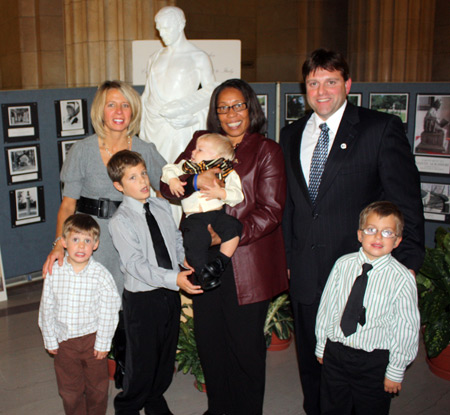 Honoree Aldo Filippelli and family with Representative Marcia Fudge