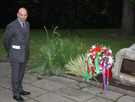 Italian Consul Marco Nobili places a wreath
