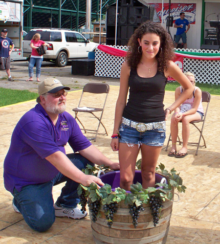 Teenage girl stomping grapes