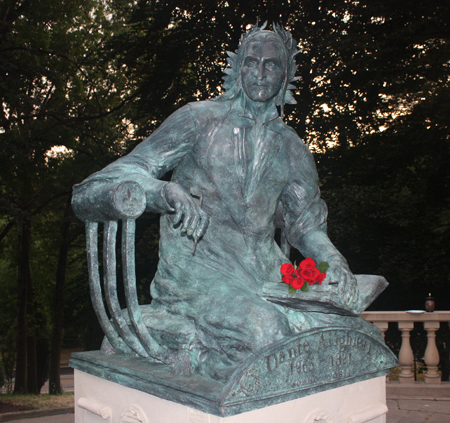 Dante statue with roses