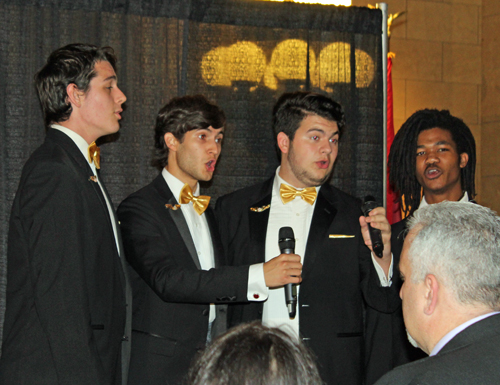 Giovanni Castiglione, Kyle Fisher, Brandon Zlotnik and Hollis Wilson who form the quartet Wing It lead the US national anthem. 