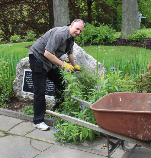 Anthony DiNardo working in the Italian Cultural Garden