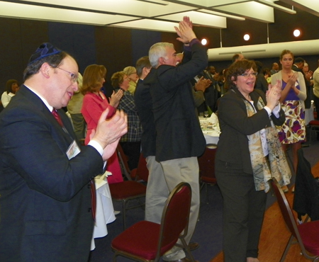 Group clapping at seder