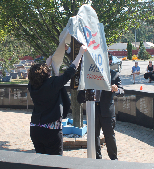 Becky Trivison and Mark Frank unveil the Ohio Historical marker