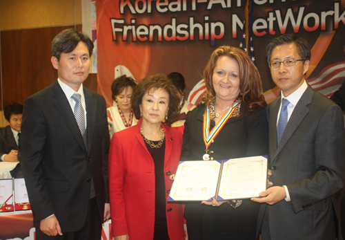 Diana Browning accepts medal for her late father