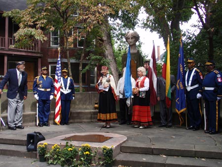 Silvija Rutenbergs adds Latvian soil to American Legion Garden