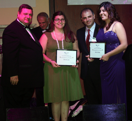 NOLAA President Pierre Bejjani and Vice-President Joseph Khadige  present scholarship awards to Ann M. Cater and Rita M. Skaaf