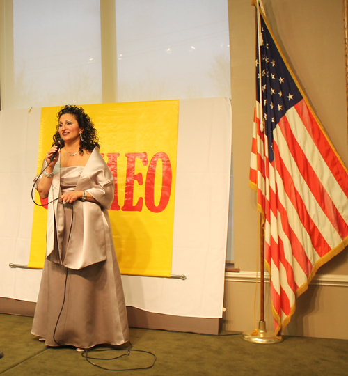 Amy George singing the national anthem at CAMEO event