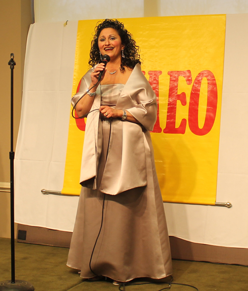 Amy George singing the national anthem at CAMEO event