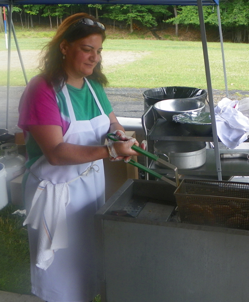 NOLAA Picnic volunteer cooking