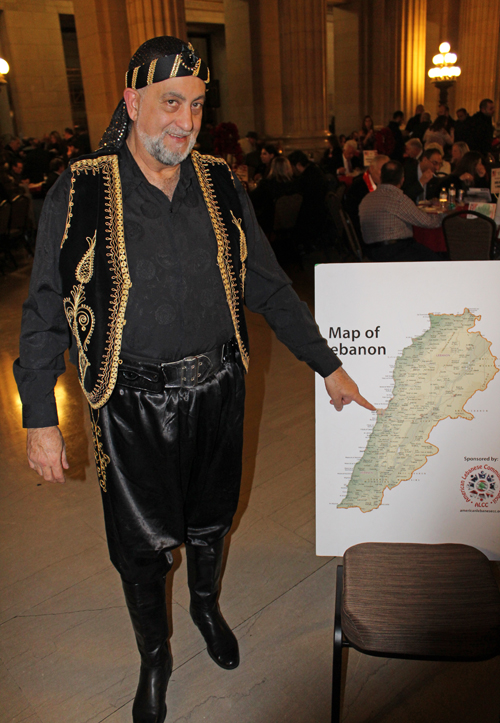 Nemer Saueidi showing his hometown on the map of Lebanon