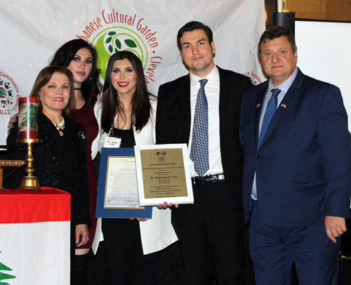 Orra family members accepting honor for the late Dr. Mahmoud Orra