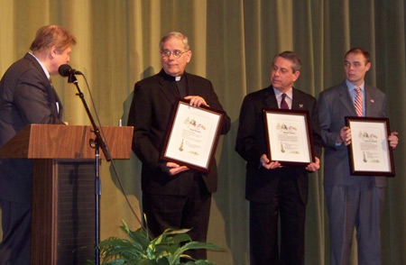 Proclamations in honor of Lithuanian Independence - Father Bacevice, Councilman Polensek and George Brown of Senator Voinovich's office