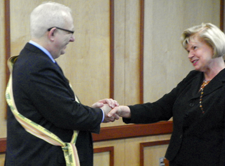 Ingrida Bublys, honorary general consul of the Republic of Lithuania in Ohio presented a traditional sash to Kent State President Lester A. Lefton