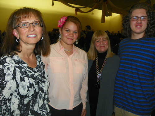 Lavonne and Leah Van Horn, Jackie and Julian Kruyne Watching Lithuanian dancers in traditional costumes