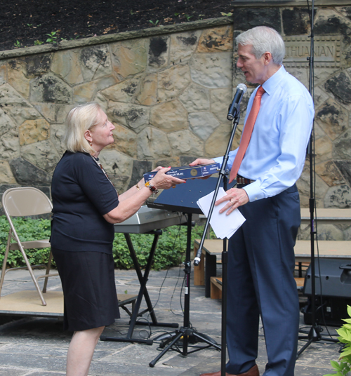 Senator Rob Portman gives flag to Lithuanian Cultural Garden