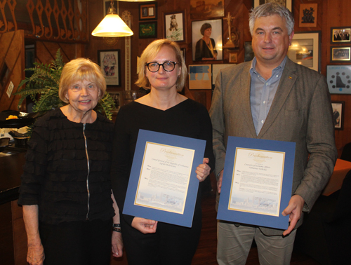 Ingrida Bublys presents proclamations from Cleveland Mayor Frank Jackson to Consul Sigrida Muleviciene and Counsellor Vidmantas Verbickas