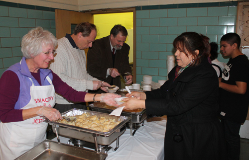 Volunteers Donna, John Niedzialek and Joe Feckanin served pierogis at St. Casimir 