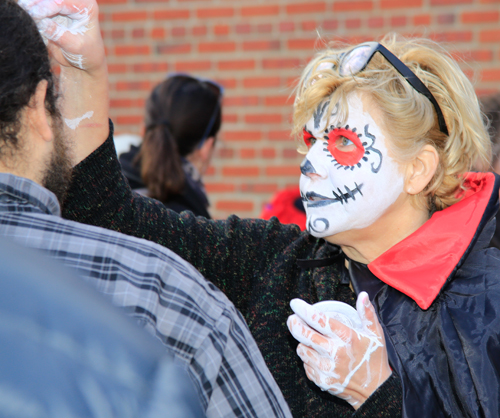 Getting ready for the Skulls and Skeletons procession on Day of the Dead in Cleveland